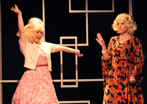 “Once upon a time I used to dress up ‘Ken’; but now that I'm a woman--I like ‘bigger’ men!”  Ellie Wyman As “Amber Von Tussle” Protests That She’s “A Big Girl Now” To Camryn Zelinger As Her ‘Mama’, “Velma”