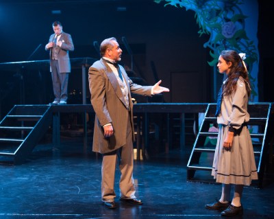 “She needs a home--the only thing she really needs I cannot give. Instead she asks a bit of earth, to make it live!” Duane Thomas as “Uncle Archibald” meets Sophia Scarsi as his niece “Mary” while Chris Peduzzi as his brother “Neville” looks on.