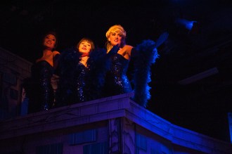 “One day you’re slingin’ hash, feeling so rejected; lightnin’ flash—you get resurrected! Make a splash—now you rate the Big Bravissimo!” (L-R: Erika Baldwin is “Ronette”, Emma Chassey is “Chiffon” and Fiona Wynder is “Crystal”)