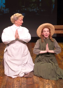 “Dear Father, I thank thee for the ‘White Way Of Delight’ and for the ‘Lake Of Shining Waters”…and that’s all the blessings I can think of right now.” Marina Coffee as “Marilla” teaches Angela Griswold as “Anne” the virtues of prayer 
