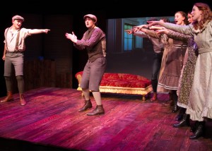 “This has been such a great party—I can think of only one more thing that would make it perfect” Brian Wiegel as “Charlie Sloane’ joins Wil Anderson as “Moody MacPherson” and their friends in a small, friendly game of “I Dare You” 