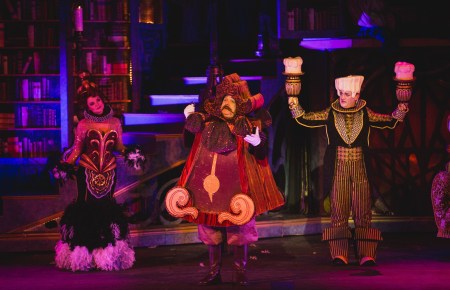 “When we're human again, only human again--When the girl finally sets us all free, Cheeks a-bloomin' again! We're assumin' again, we'll resume our long lost joie de vie!” Melina Kalomas as ”Babette”, Joey D’Auria as “Cogsworth” and Dennis Kyle as “Lumiere” dream of the day they’ll be ‘Human Again”