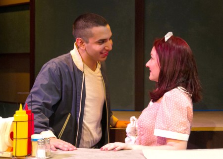 “Well, I better shove off soon—gotta get to a party. Say! Maybe you’d like to go with me?” Andrew Puente as “Eddie” invites Ashley Arlene Nelson as “Rose” to “Come To A Party”