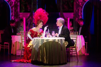 “No Horace, a complaining, quarrelsome friendless soul like you is no sort of companion for me! You salt your beets and I’ll salt mine!” Valerie Perri as “Dolly Levi” is putting ideas in Robert Yacko as “Horace Vandergelder’s” head in 3-D Theatricals’ “Hello Dolly!”