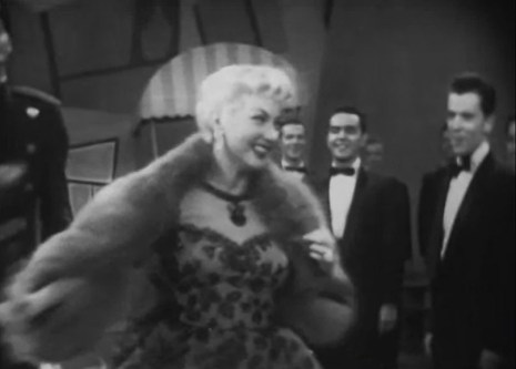 “In all my flights of fancy your image I drew—I look at you and I can see that fancy come true!” Ann Sothern as “Girl Of The Moment” “Liza Elliott” is serenaded by her adoring admirers in “Lady In The Dark” 