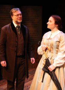 “If I have noticed nothing else about you, Miss March, I have noticed that you are unique. Something you should try not to forget. I think you could do better.” Nicholas Thurkettle as “Professor Bhaer” chides Ashley Arlene Nelson as “Jo” regarding her “Blood and Guts stuff” manuscript in “The Chance Theater’s “Little Women—The Broadway Musical”